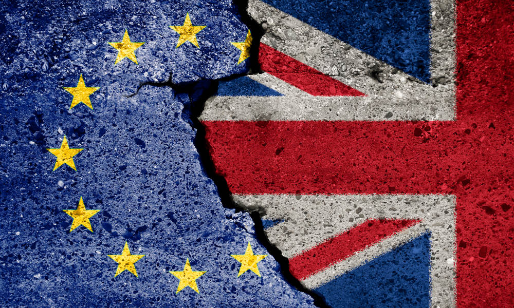 Brexit symbol. Concept illustration. EU and UK flag on broken wall.