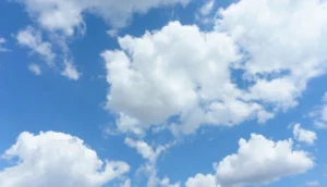 Bright blue sky filled with fluffy white clouds