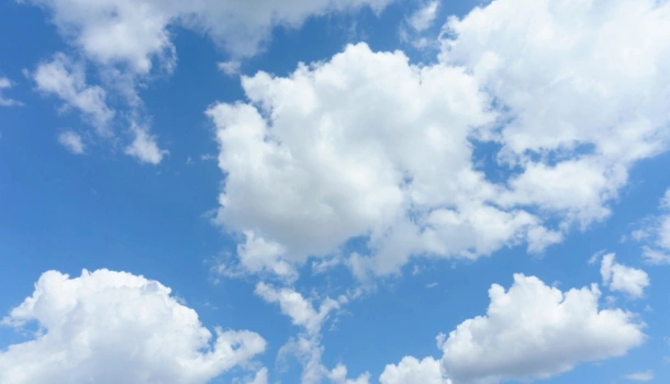 Bright blue sky filled with fluffy white clouds