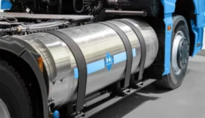 Close-up of a hydrogen fuel tank mounted on a blue commercial truck