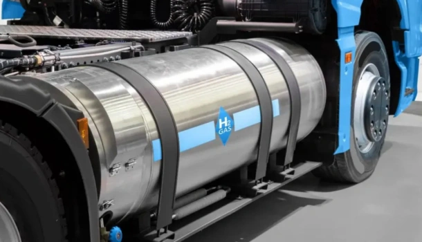 Close-up of a hydrogen fuel tank mounted on a blue commercial truck