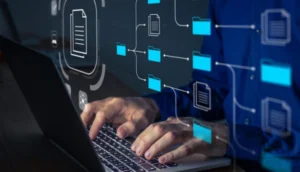 A person types on a laptop with digital icons of folders and documents overlayed
