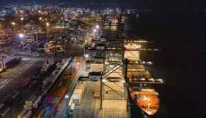 Nighttime aerial view of a busy UK shipping port