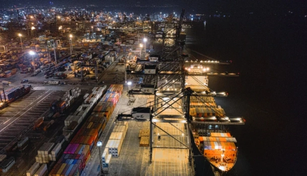 Nighttime aerial view of a busy UK shipping port